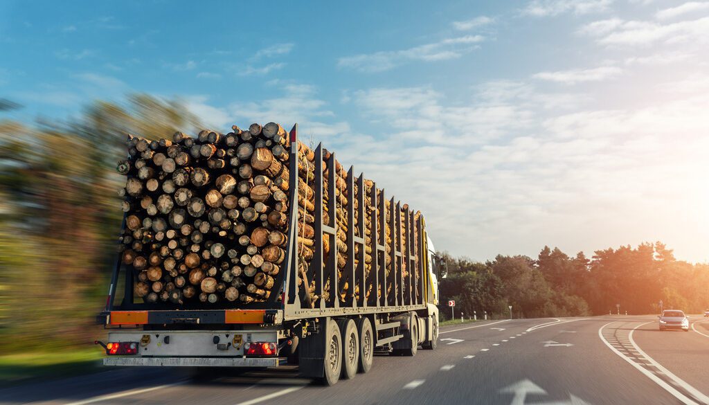 Wood Carrier on the Highway Demonstrating Advantages of a Log Trailer