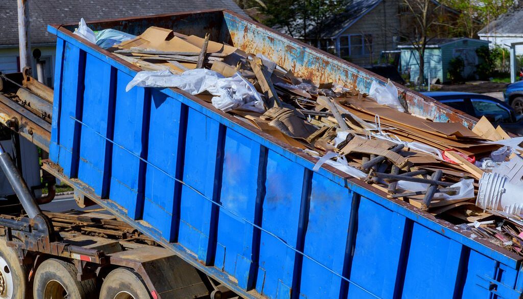 Closeup of a Blue Tipper Refuse Trailer Filled With Trash and Debris