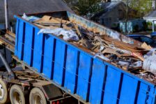 Closeup of a Blue Tipper Refuse Trailer Filled With Trash and Debris