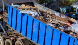 Closeup of a Blue Tipper Refuse Trailer Filled With Trash and Debris