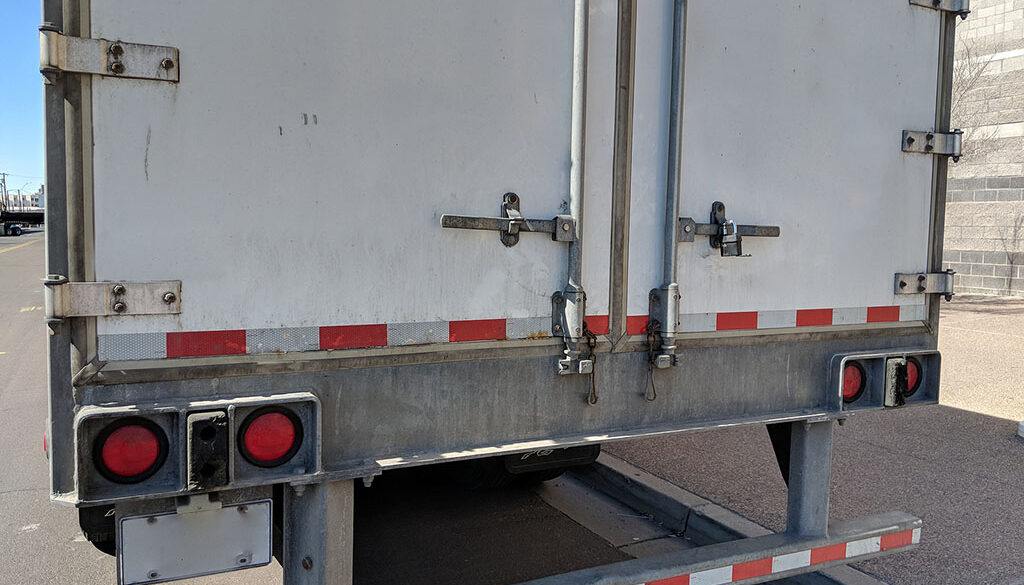 Closeup Of The Rear Doors Of A Trailer Door Hinge Replacement
