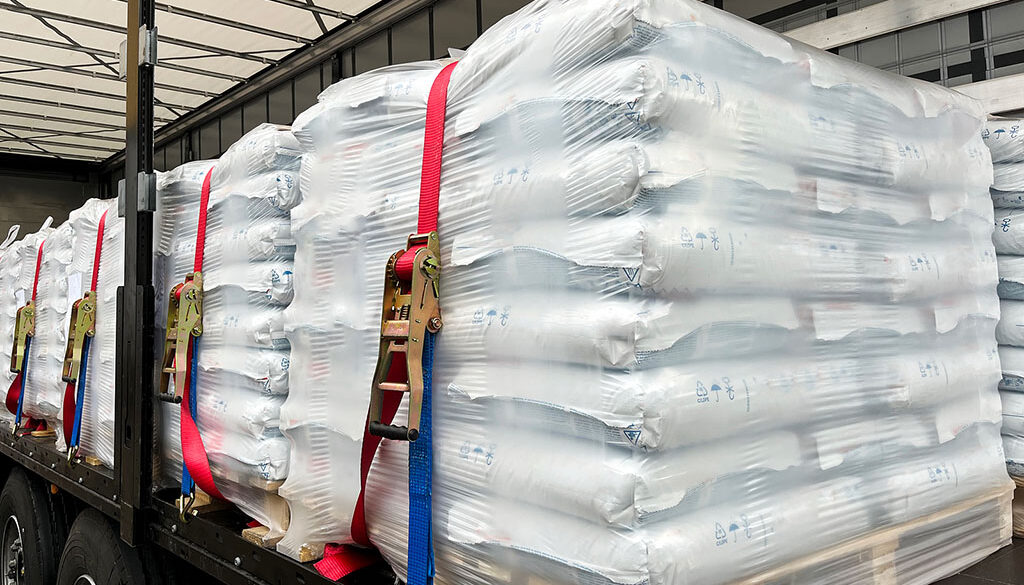 Closeup Of Bulk Materials Strapped Inside The Back Of A Trailer Using Proper Trailer Cargo Securement Methods