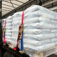 Closeup Of Bulk Materials Strapped Inside The Back Of A Trailer Using Proper Trailer Cargo Securement Methods