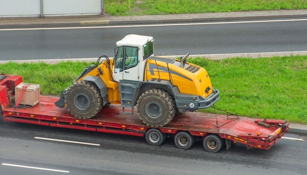 A Long Truck Shows A Helpful Type of Construction Trailer