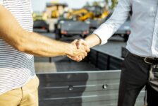 Closeup of a Trailer Salesman Shaking Hands With a Customer What Is Pinnacle Trailer’s Hold It for Me Program